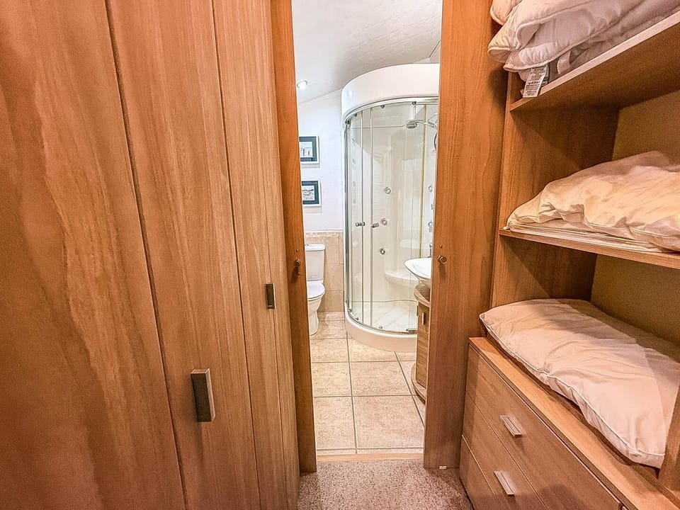 Step inside this holiday home lodge at Manor Park Holiday Park and discover a living area designed for relaxation after a day of exploring Hunstanton.