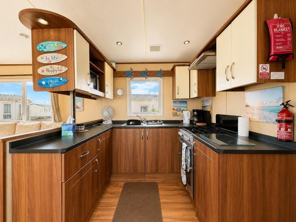 Our caravan's kitchen at Dovercourt Holiday Park helps make family holidays more affordable and enjoyable.