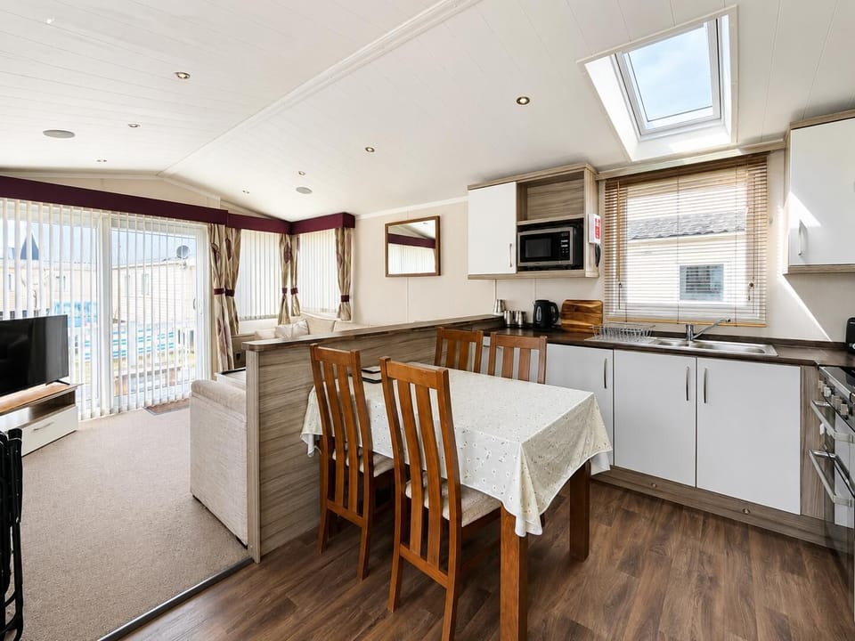 Make holidays 2026 unforgettable with a cosy caravan stay near Pakefield Beach Lowestoft, perfect for a family on holiday seeking seaside adventures.