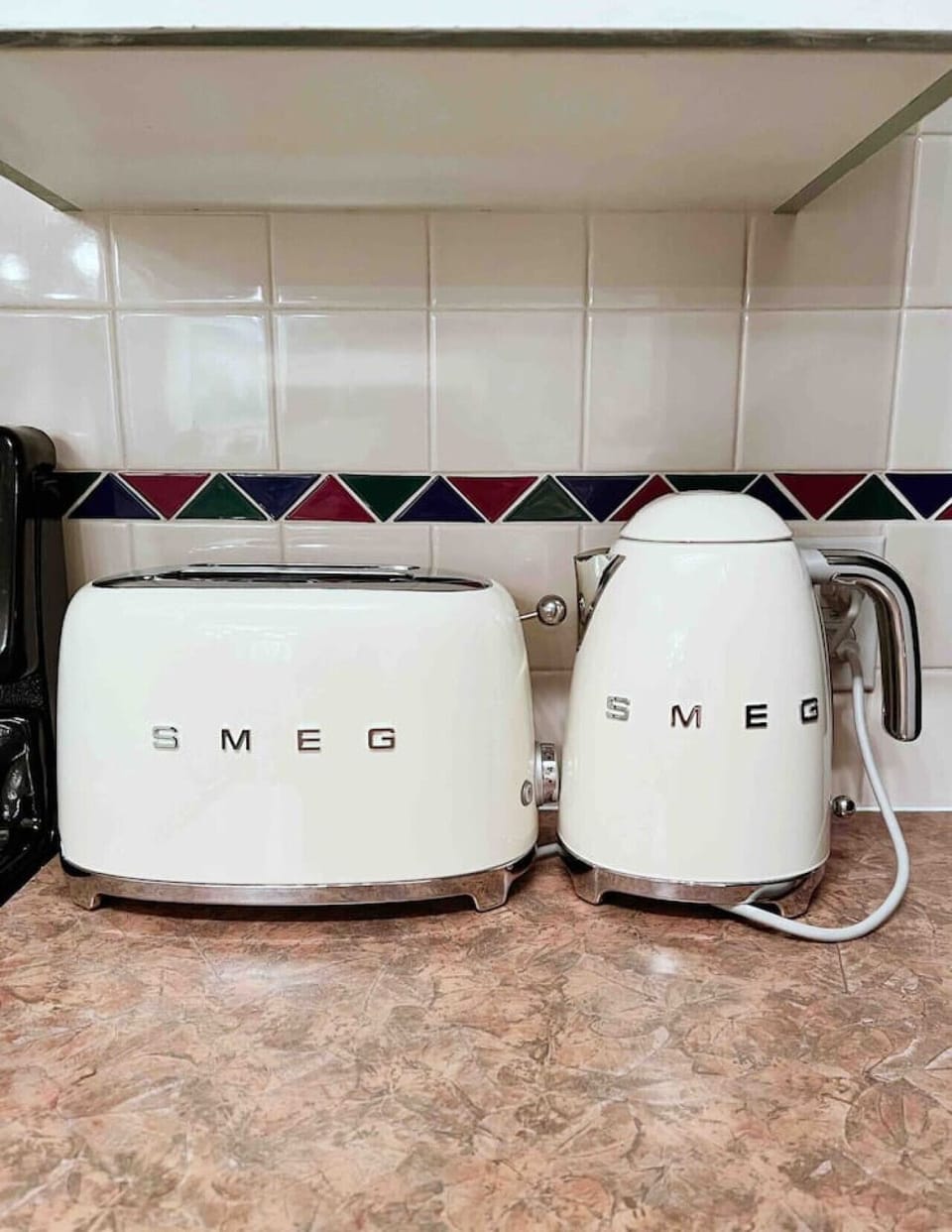 Stylish SMEG appliances add a modern, high-end touch.
