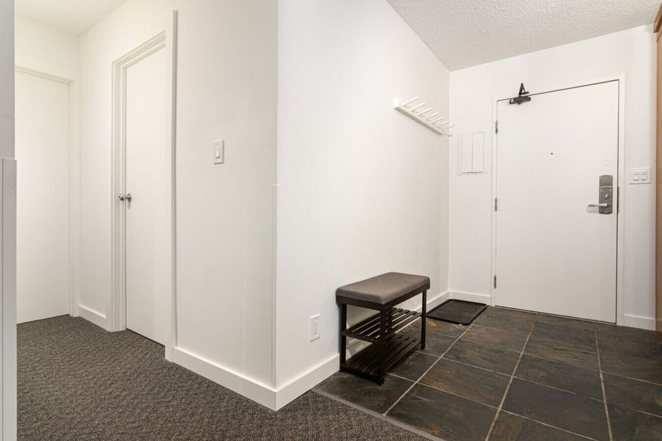 Inviting entryway with coat rack for jackets, shoes, and outdoor apparel
