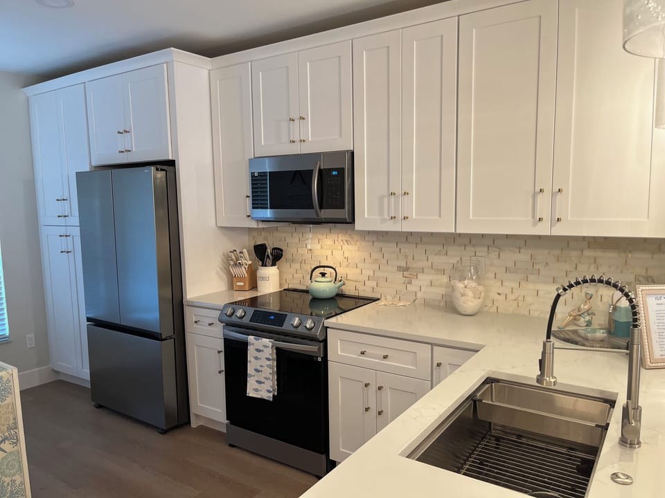All new custom kitchen w/42" cabinets, quartz, built-in pantry, new appliances!