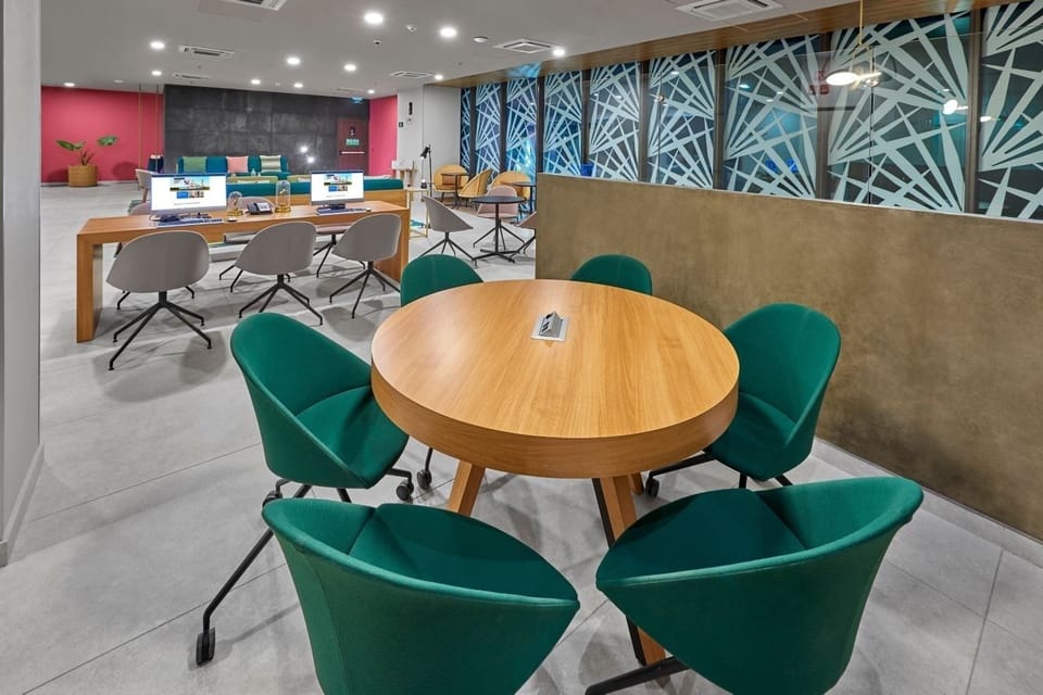 Dine comfortably in the bright restaurant with modern seating.
