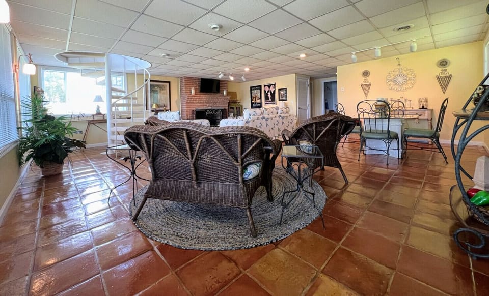 Lower level entrainment area with waterfront views overlooking Weiss Lake