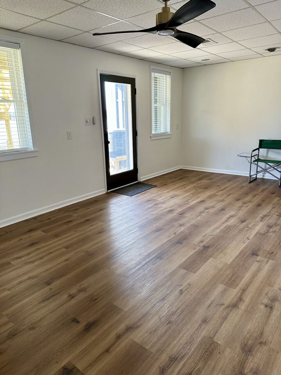 Open bonus room on lower level with exit to waterfront patio and pier