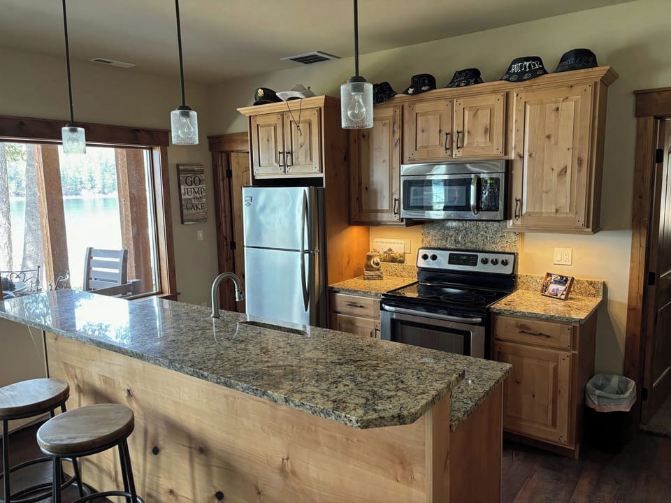 Kitchen Downstairs with outdoor covered patio shown on left.