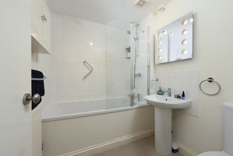 Bathroom with bath and shower over - Bessie Ellen's Cottage
