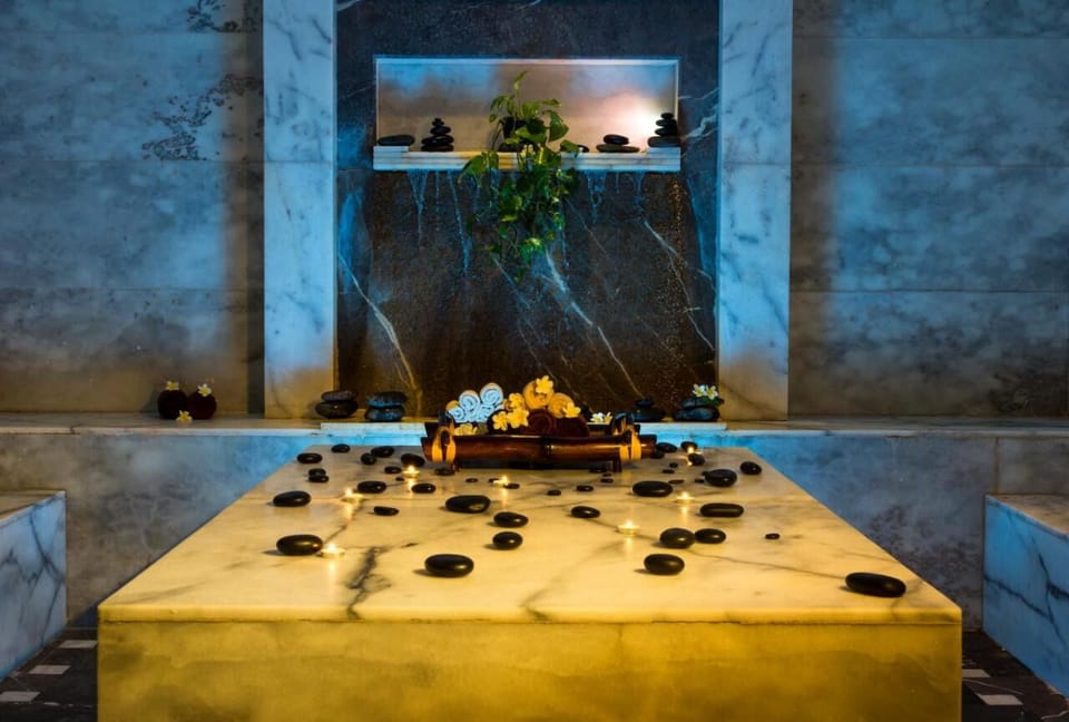 Recharge in calming spa rituals with soft candlelit serenity.