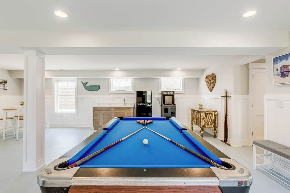 Ground-Level Rec Room with Pool Table, Wet Bar, and Arcade Game