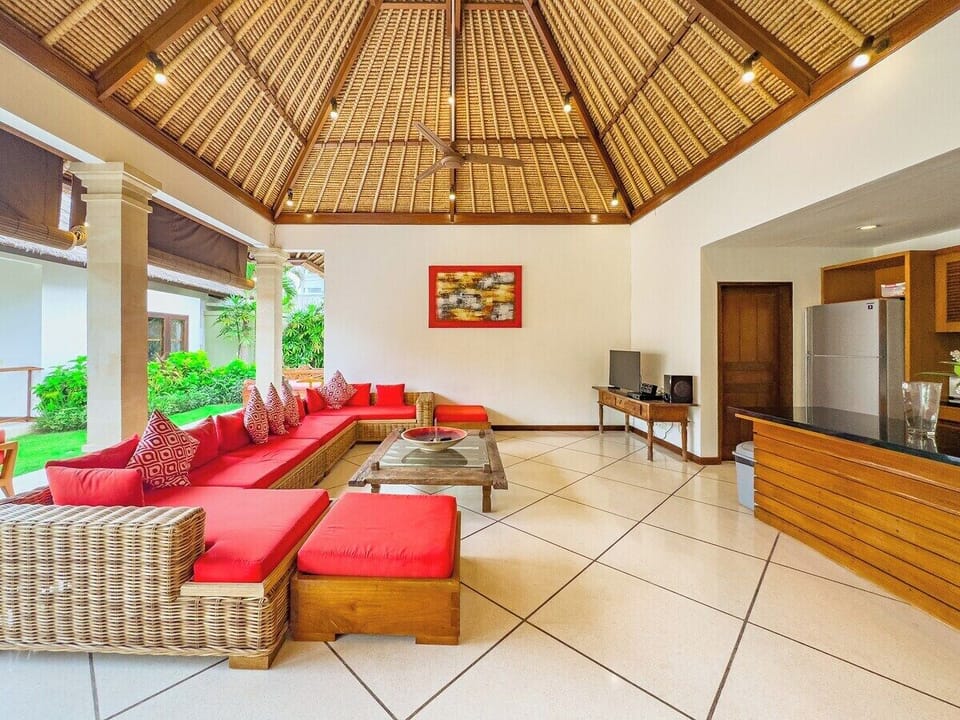 Living Room

Situated at the lower left corner near the main entrance, this open-style living area is perfect for family relaxation.
It features a comfortable sofa set, a coffee table, and direct views of the tropical garden and swimming pool.