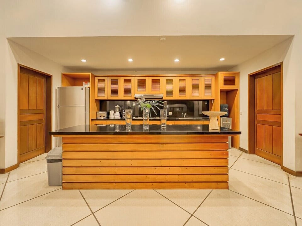 Kitchen

Adjacent to the dining area, the kitchen is designed efficiently with full amenities and direct access to the service/laundry zone — ideal for staff convenience and daily use.