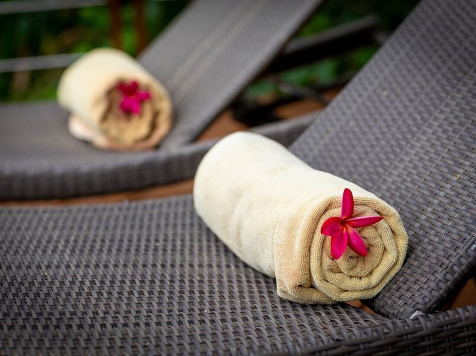 Luxury spa amenities with tropical flower details - Villa Soluna 5-bedroom hillside retreat southern Koh Samui