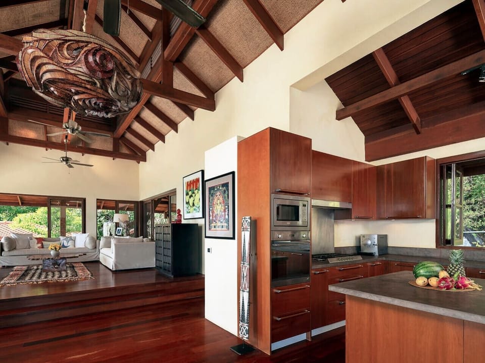 Modern fully-equipped kitchen with wooden cabinetry and tropical garden views - Villa Soluna 5-bedroom luxury hillside retreat southern Koh Samui