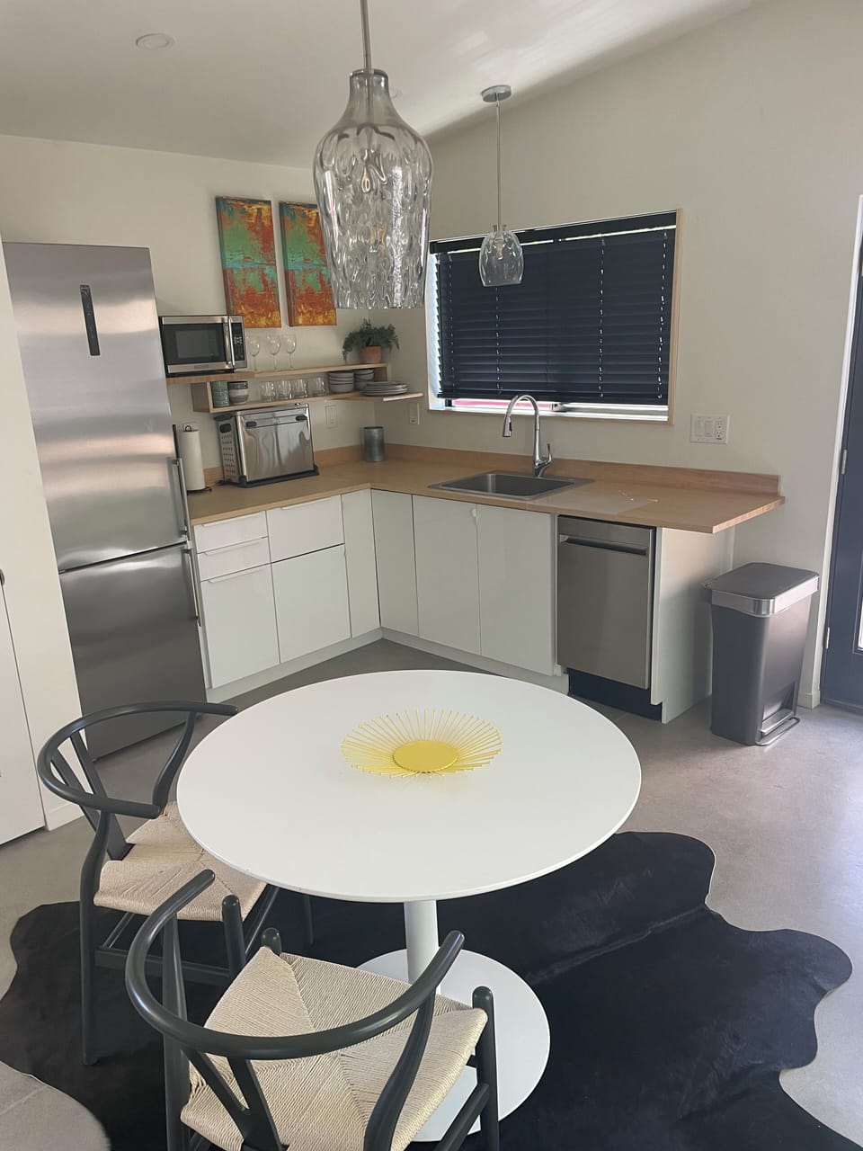 Dining/kitchen area.  In unit laundry is in closet to the left of refrigerator.