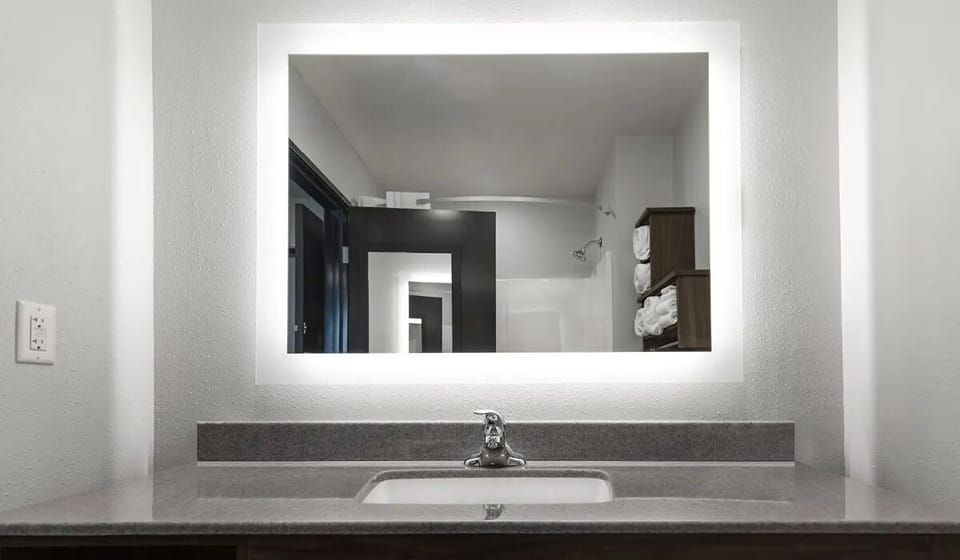 Refresh easily at the bright vanity with glowing mirror light.