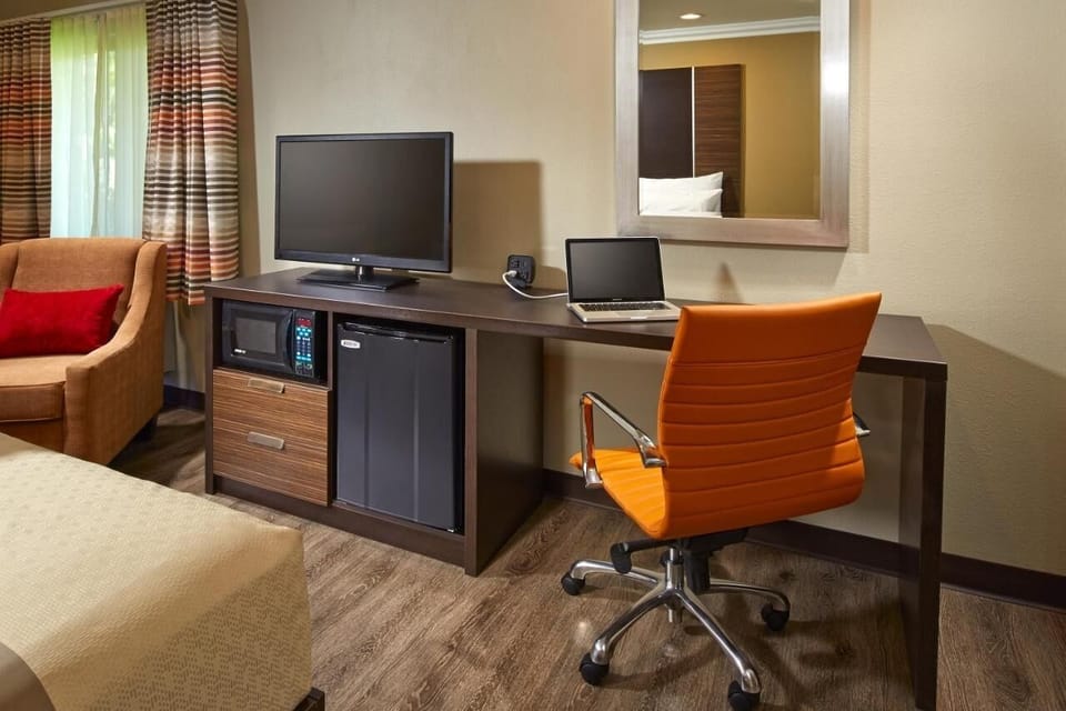Settle in and stay productive with desk, TV, and snacks.