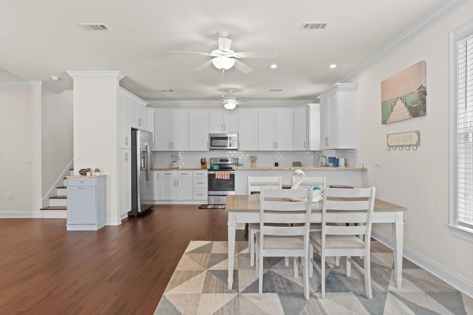 Full kitchen view — featuring stainless steel appliances and sleek countertops.