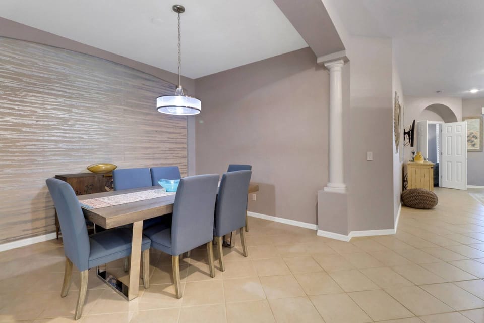 The dining alcove, across from the kitchen, has a dining table with seating for 6.