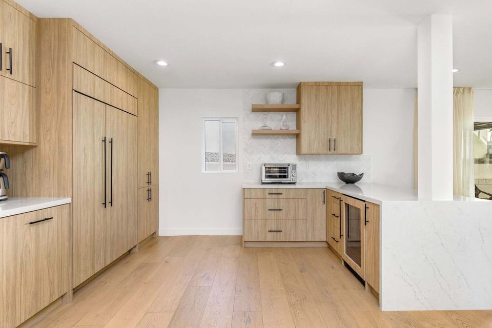 Let the chevron tile and custom oak cabinetry elevate every moment