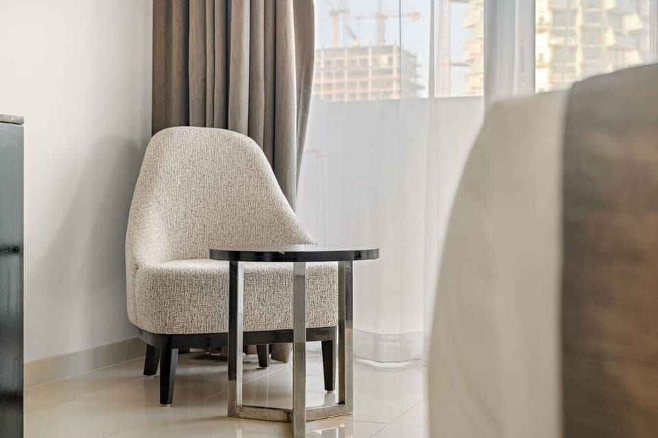 Reading Nook: Relax in style with a chic armchair and sleek side table by the window!