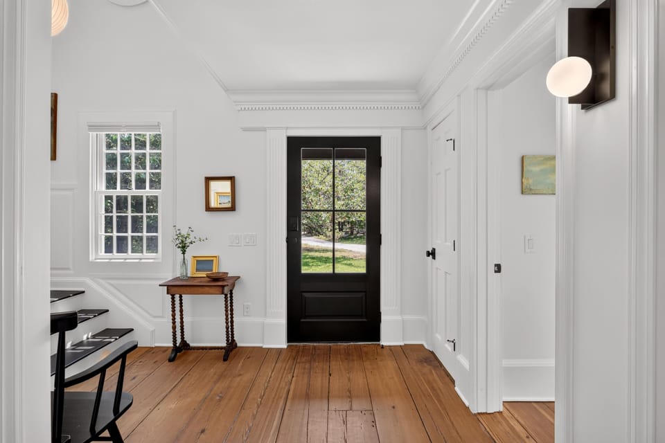 Foyer with steps leading to the second floor