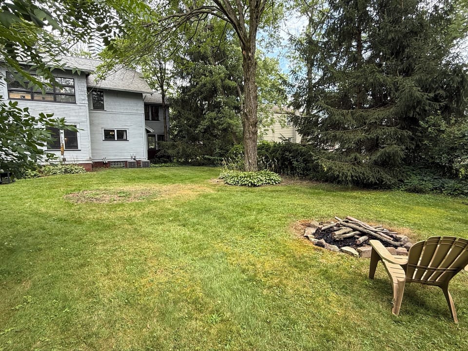 Firepit in the back with 6 adorondak chairs