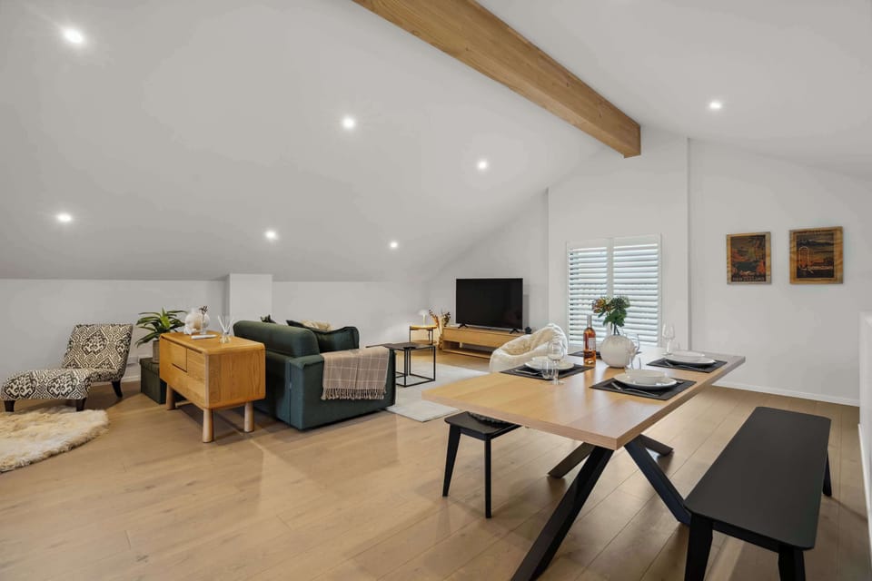 Spacious lounge and bedroom in an open studio layout