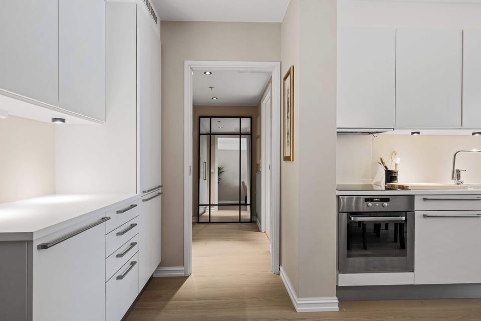 Hallway view leading into the bright and inviting kitchen.