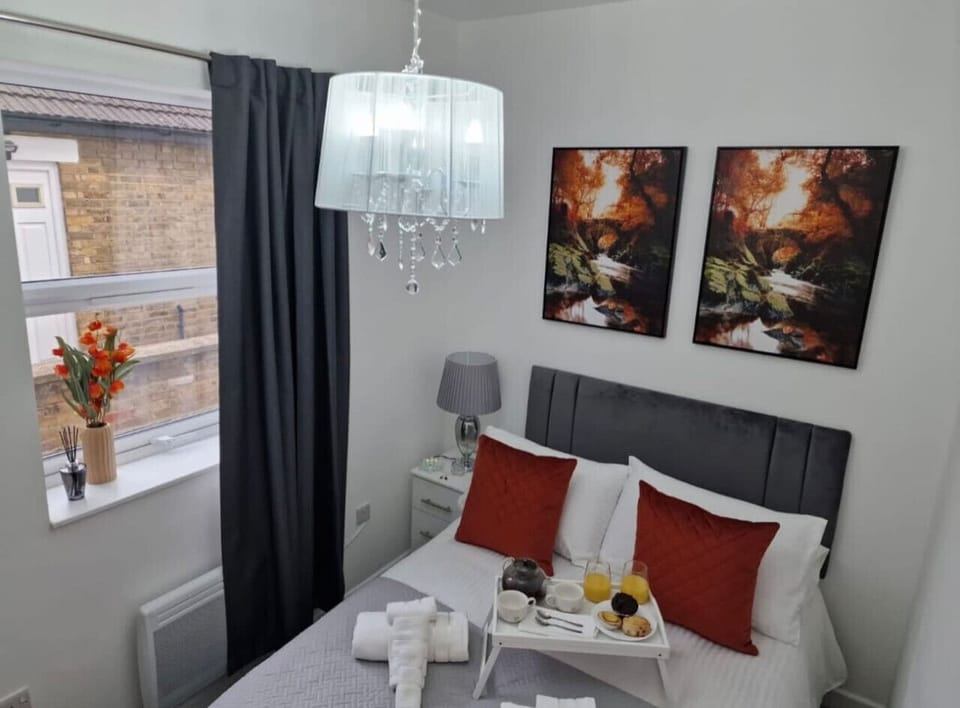 Comfortable sleeping space with quality bed linens, extra pillows, blackout shades, and clothing storage. Essentials like washer, dryer, iron, hangers, and drying rack make longer stays easy.