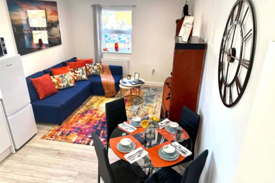 A bright and welcoming space with comfortable seating and a TV, perfect for relaxing after a day out.