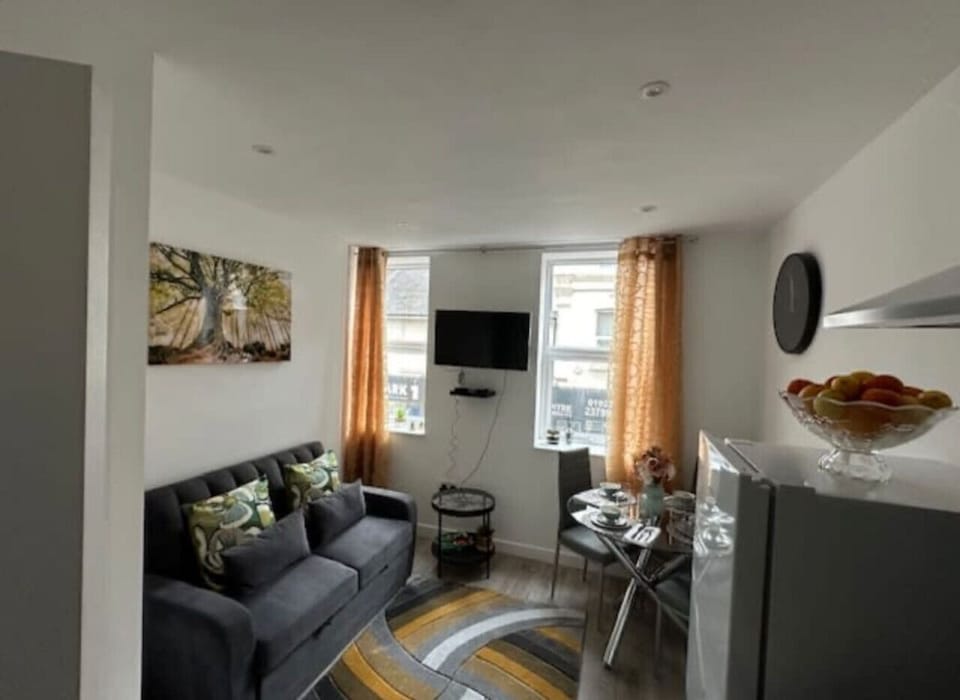 Relax in a cozy lounge with a TV and high-speed WiFi, ideal for streaming or remote work.