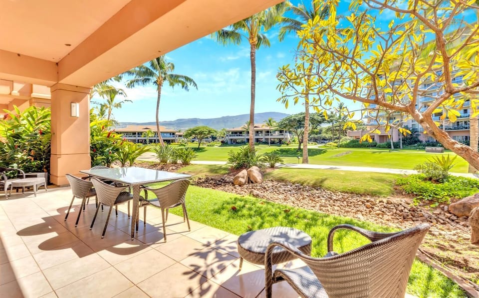 Tranquil patio view with lush greenery and mountain backdrop serenity. HKK-104