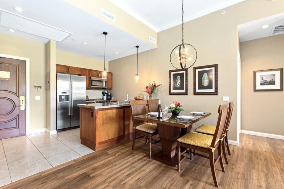 Sleek kitchen and cozy dining invite island-style meals and conversation. HKK-112