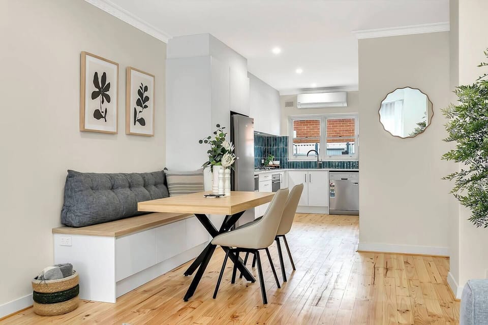 Gather at the thoughtfully designed dining bench with soft-cushioned seating and timber tones—an inviting spot for shared meals or morning coffee.