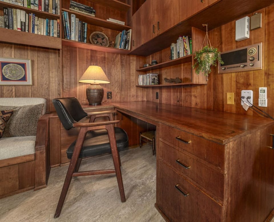 Built-in Beauty: Gorgeous custom wood built-ins and an integrated bookshelf offer sophisticated storage and a curated library feel