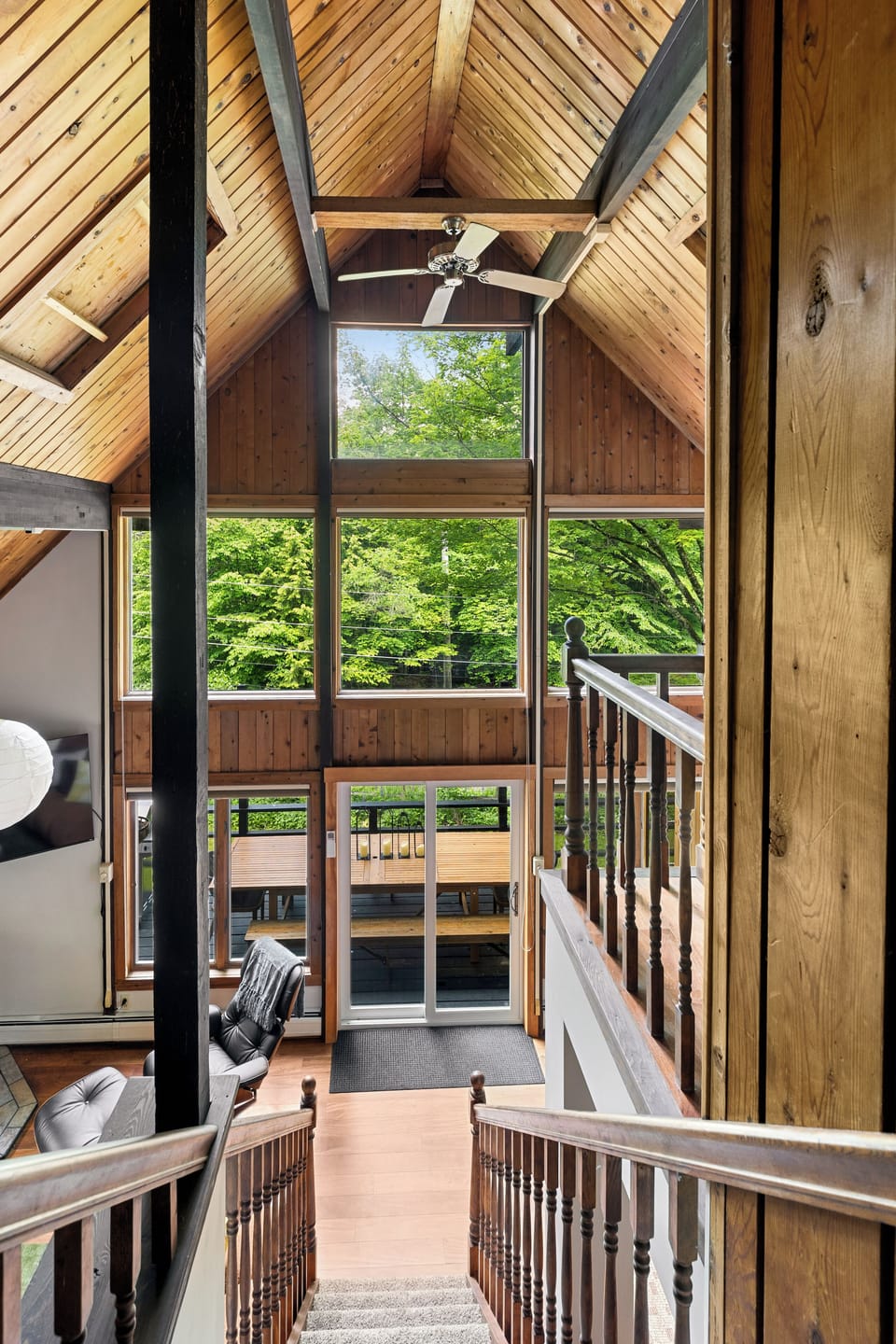 View coming down the stairs from the top level master suite.