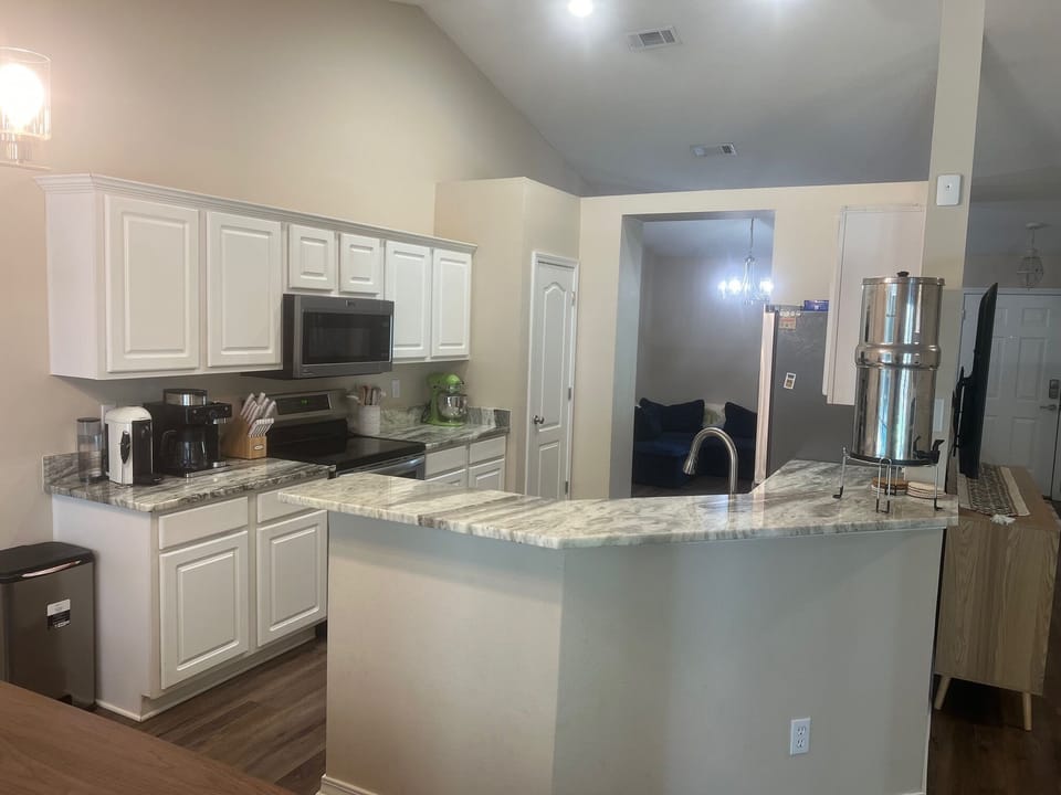 Kitchen with amenities - coffee pots, mixer, dishes & utensils
