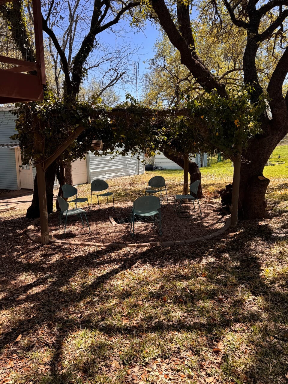 shaded outside gazebo with fire pit- perfect for evening gatherings 