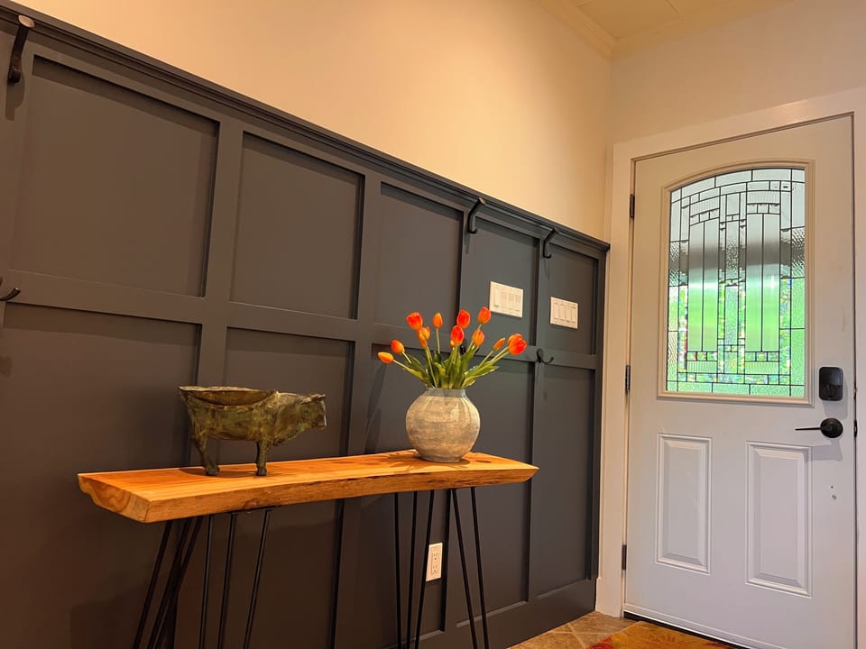 Front entry with lots of hooks for hanging and a handy bowl for keys and sundry.