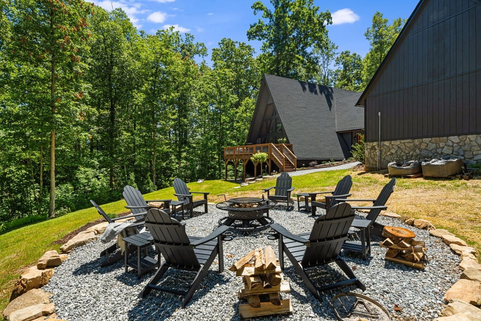 Gather with friends & family at the firepit, with 8 classic Adirondack chairs + side tables on a gravel pad and a boulder border. Whether you're roasting marshmallows, sharing stories, or stargazing, this cozy outdoor setup is made for unforgetable moments