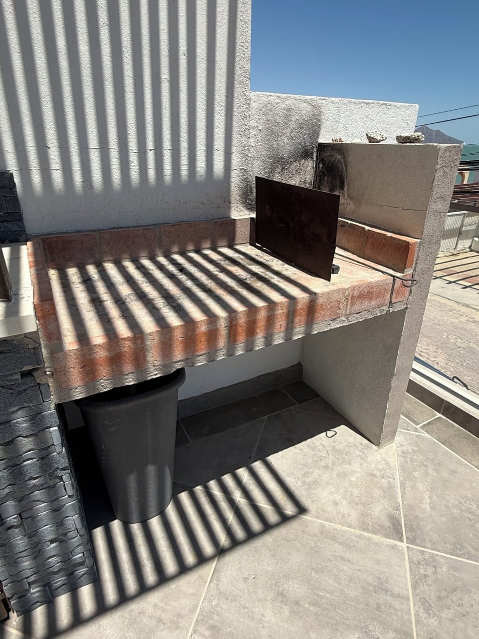 Outdoor- balcony off kitchen -charcoal BBQ