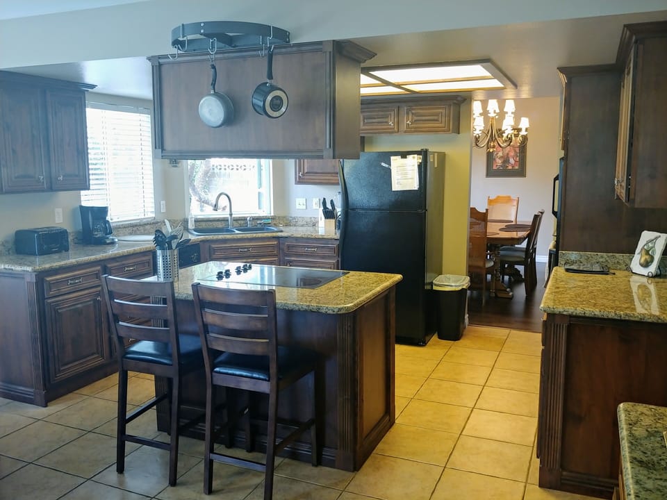 Kitchen has a breakfast bar that seats two people  