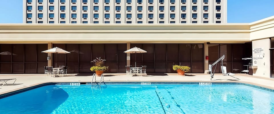 Linger poolside under umbrellas for a laid-back afternoon.