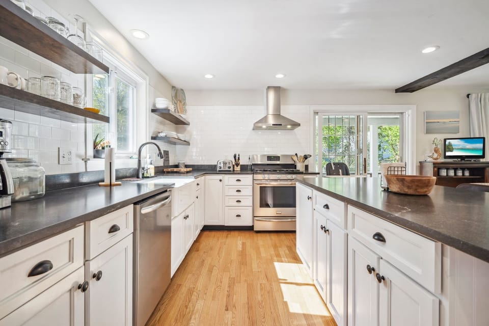 Fully equipped kitchen with dishwasher! This space is perfect for family gatherings. High chair is located in the kitchen. 