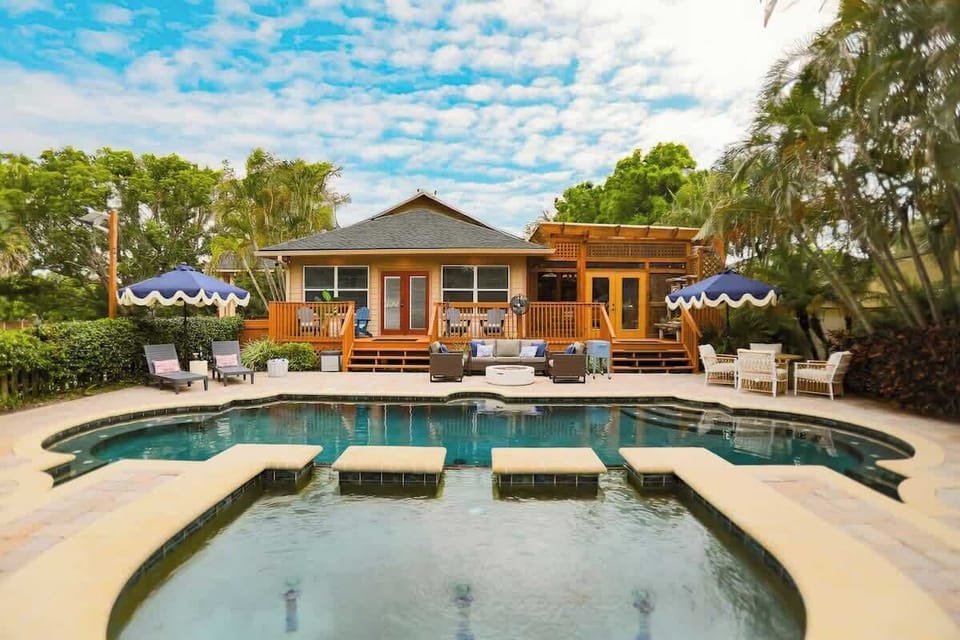Dive into relaxation in this grand, resort-style pool surrounded by elegant lounge chairs, umbrellas, and lush landscaping. It’s the centerpiece of the manor—perfect for sun-soaked days and refreshing swims.