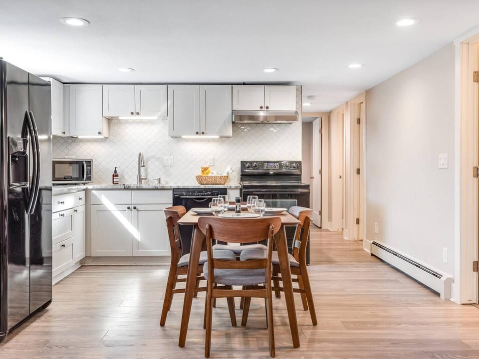 Modern kitchen with full appliances + dining for 6 — cook meals at home or enjoy takeout from Denver’s foodie hotspots