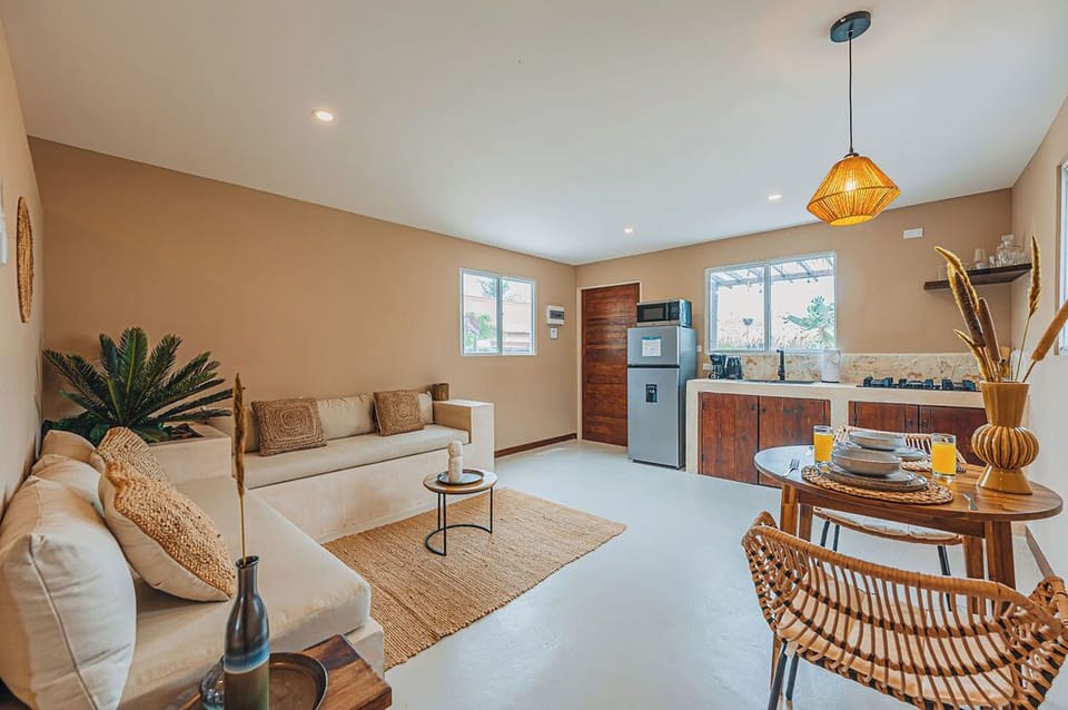 Comfortable seating paired with warm wood accents and an easy flow into the dining and kitchen areas.


