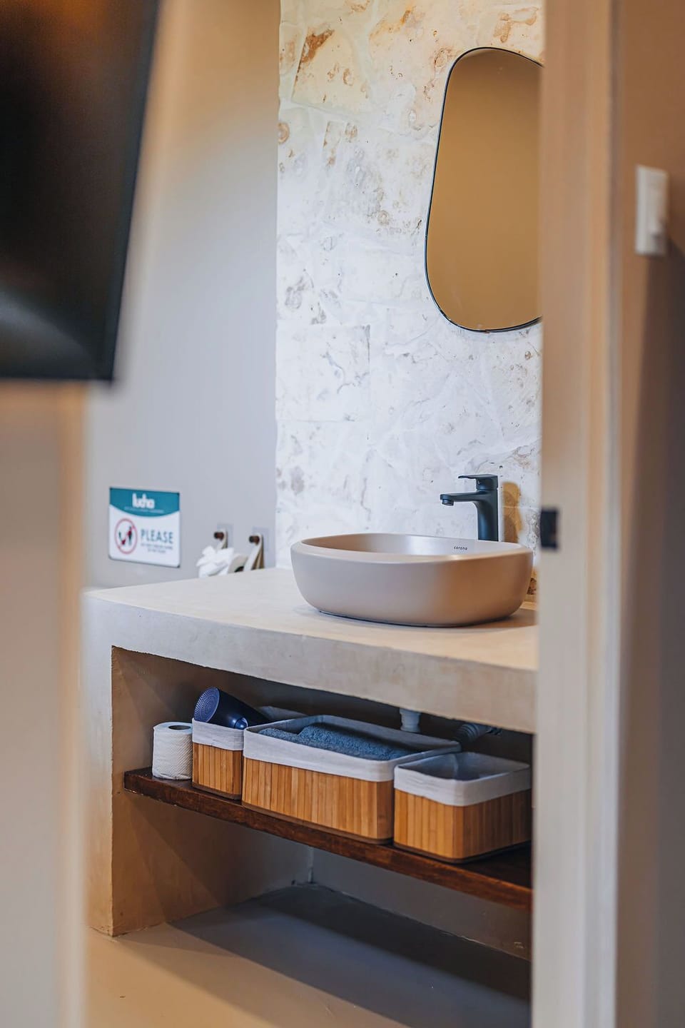 Stylish bathroom vanity with a modern vessel sink, sleek fixtures, and thoughtful storage below.


