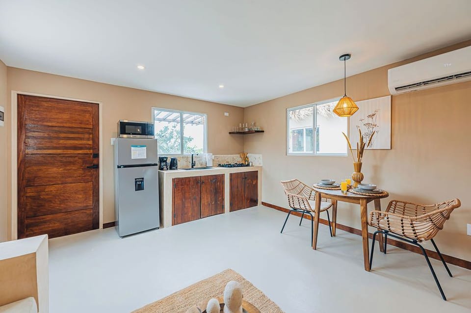Functional kitchen and dining setup with all the essentials for a comfortable stay.

