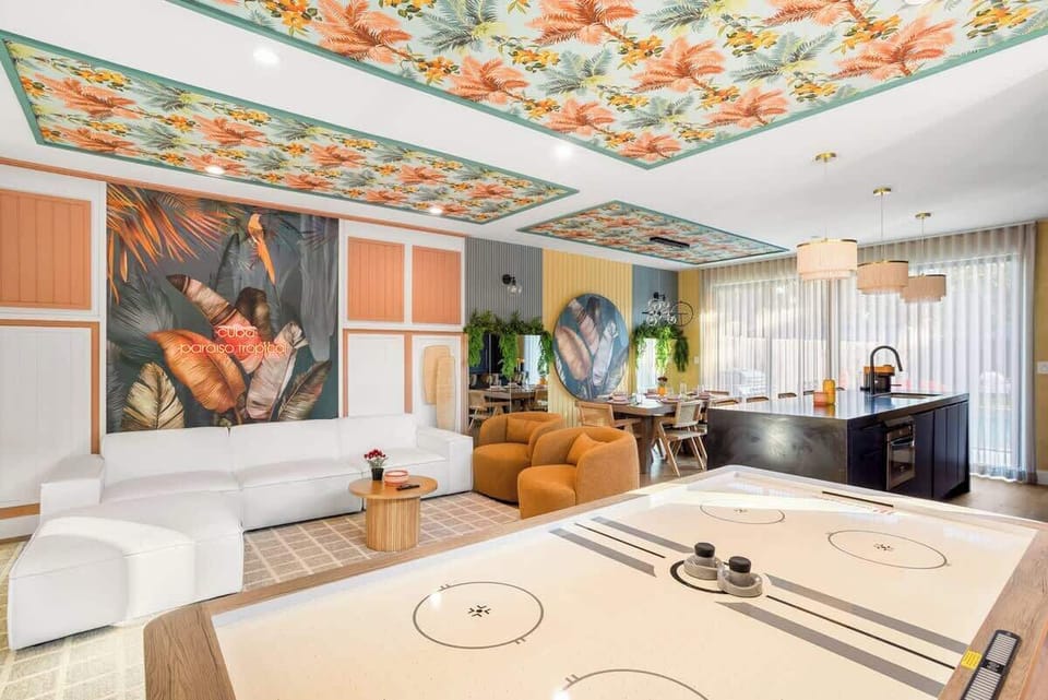 Get ready to have a blast in this incredible Game Room! We wanted a space that was pure fun, and this one delivers with a sleek Air Hockey table and a cool, tropical vibe.